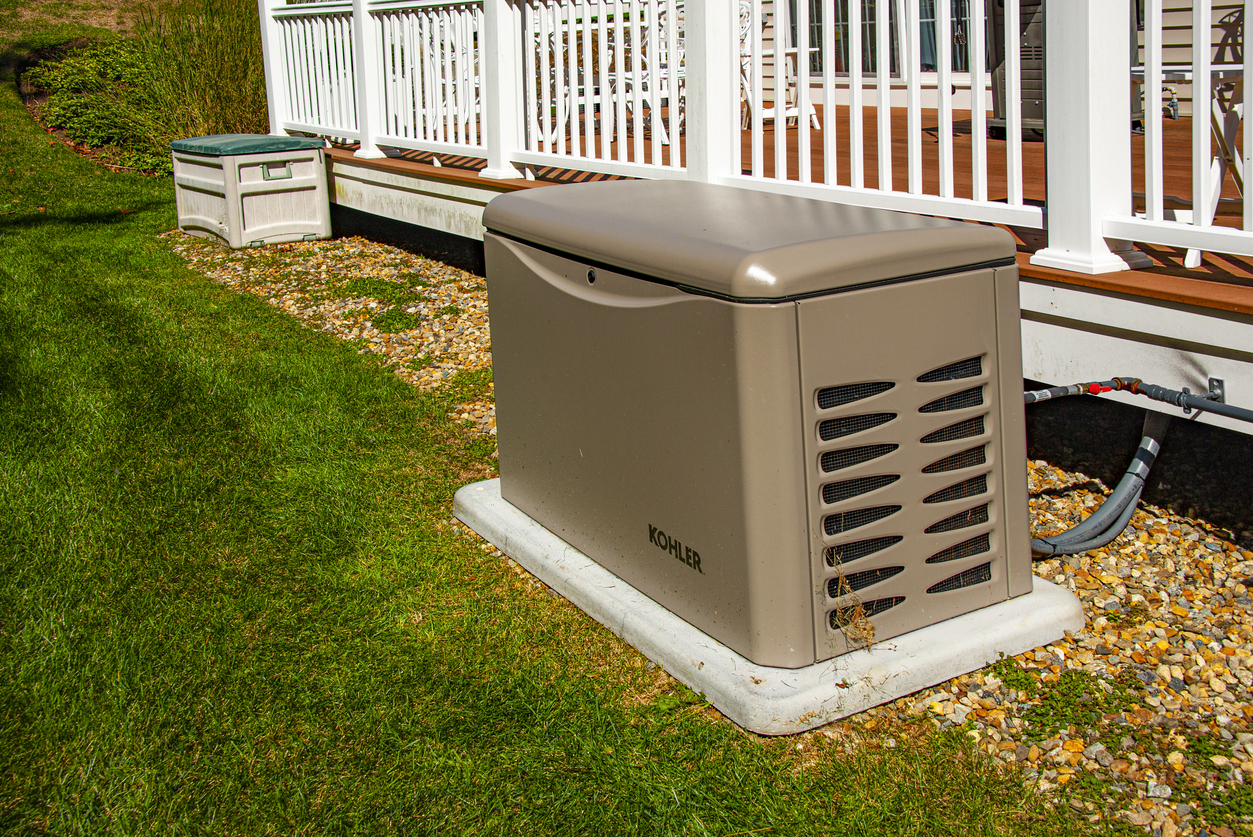 Newbury, USA - September 29, 2022: Residential standby generator on concrete pad